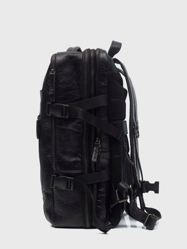 Denver black leather travel backpack shown from the side on neutral background