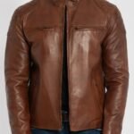 Close up of snap button band collar and zip pocket details on brown leather jacket