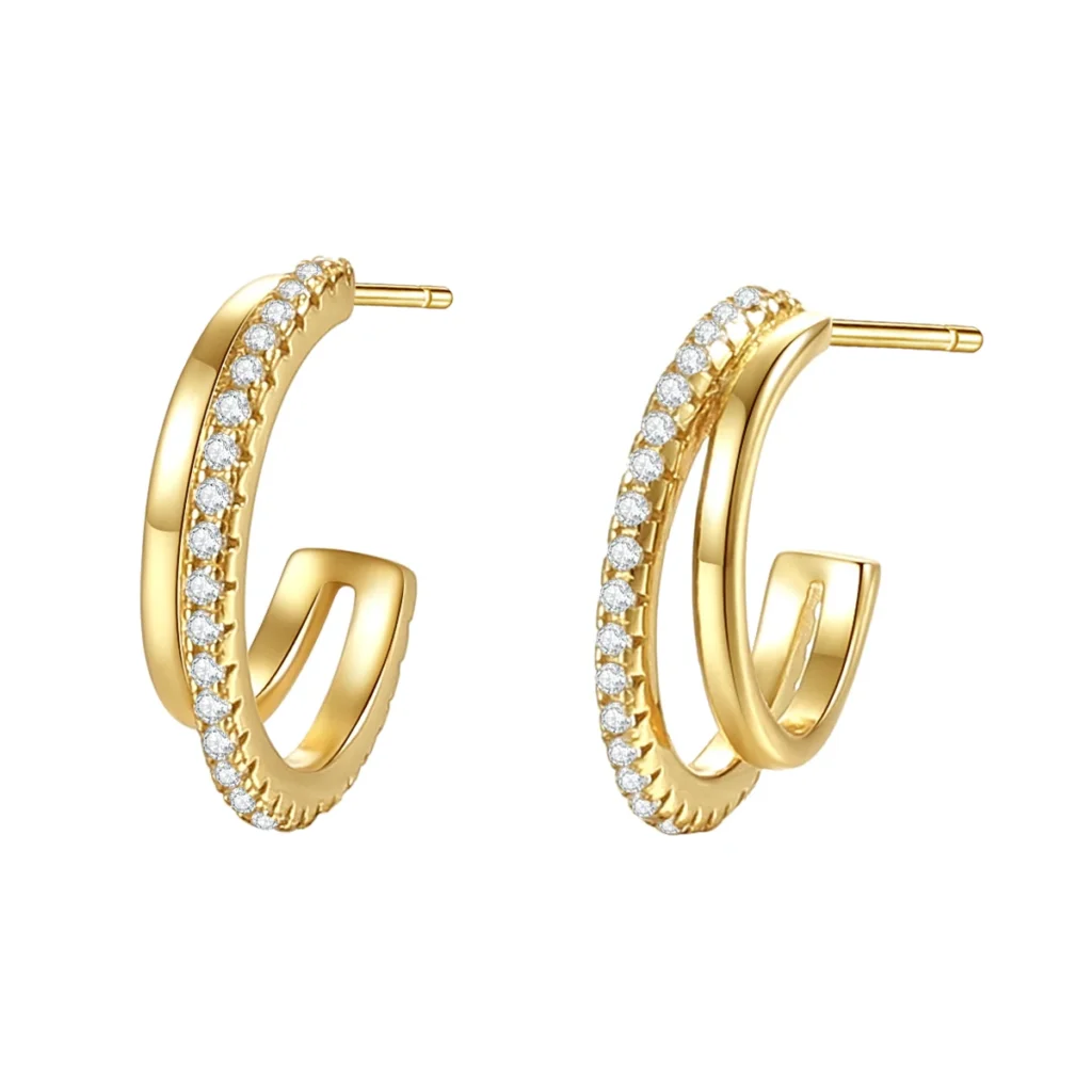 Gold double hoop earrings with sparkling zirconia stones on a white background